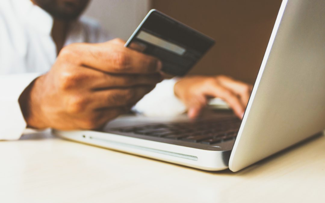 customer using credit card to make purchase online with an ecommerce solution